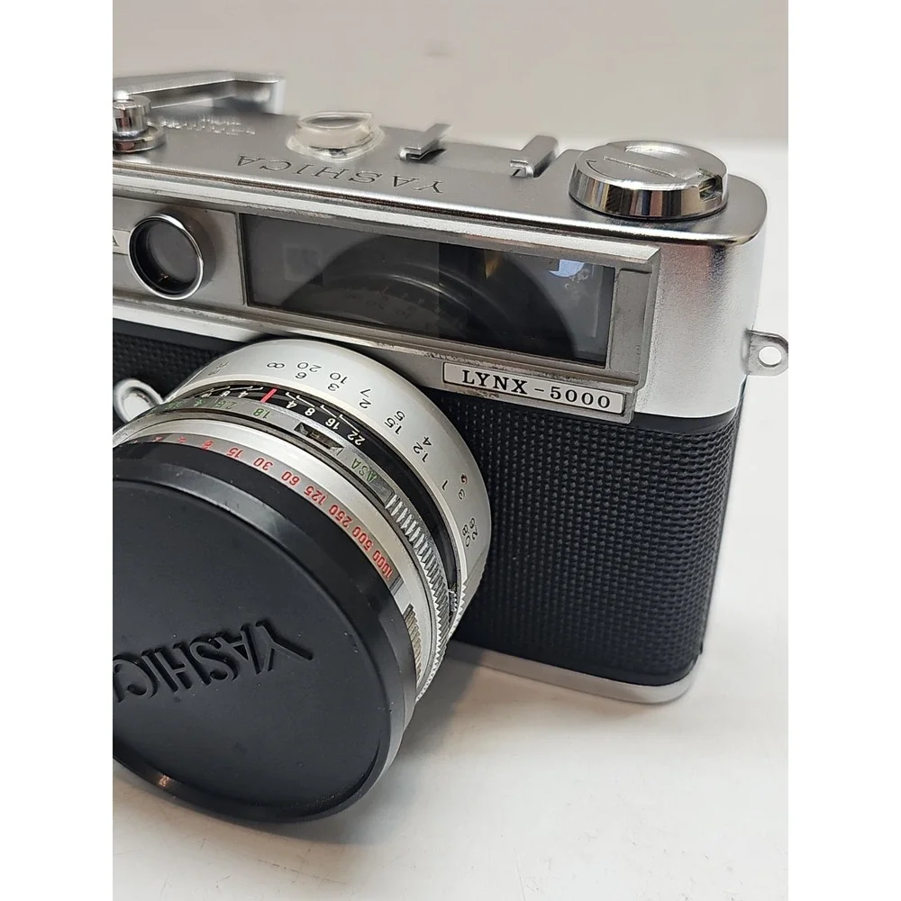 Yashica Lynx 5000 35mm Rangefinder Film Camera.  45mm f/1.8 Lens. W/ Casing